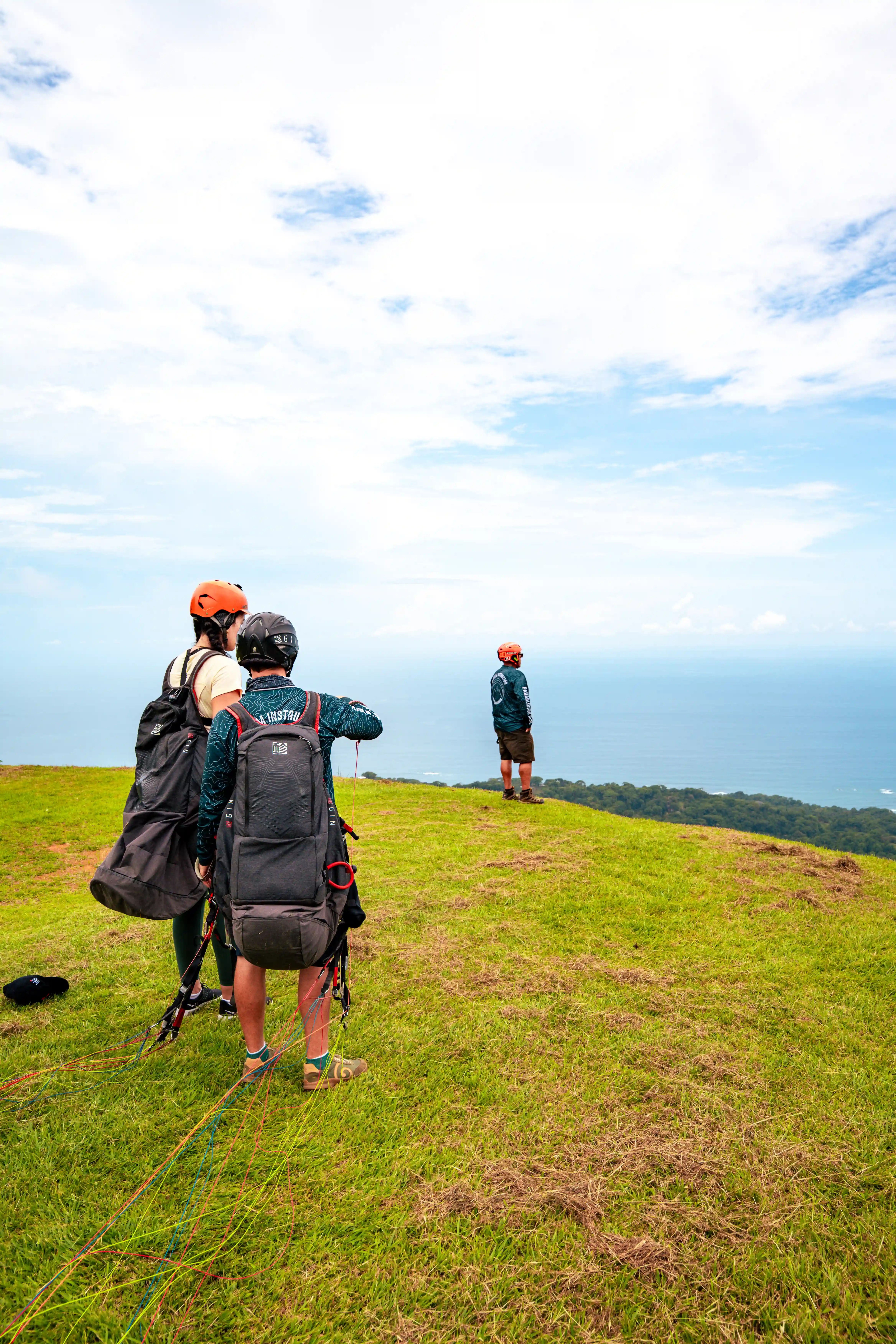 Guest preparing for paragliding at sunrise near Vajra Jahra Retreat Center, an adventurous Corporate Retreat Venue in Costa Rica.