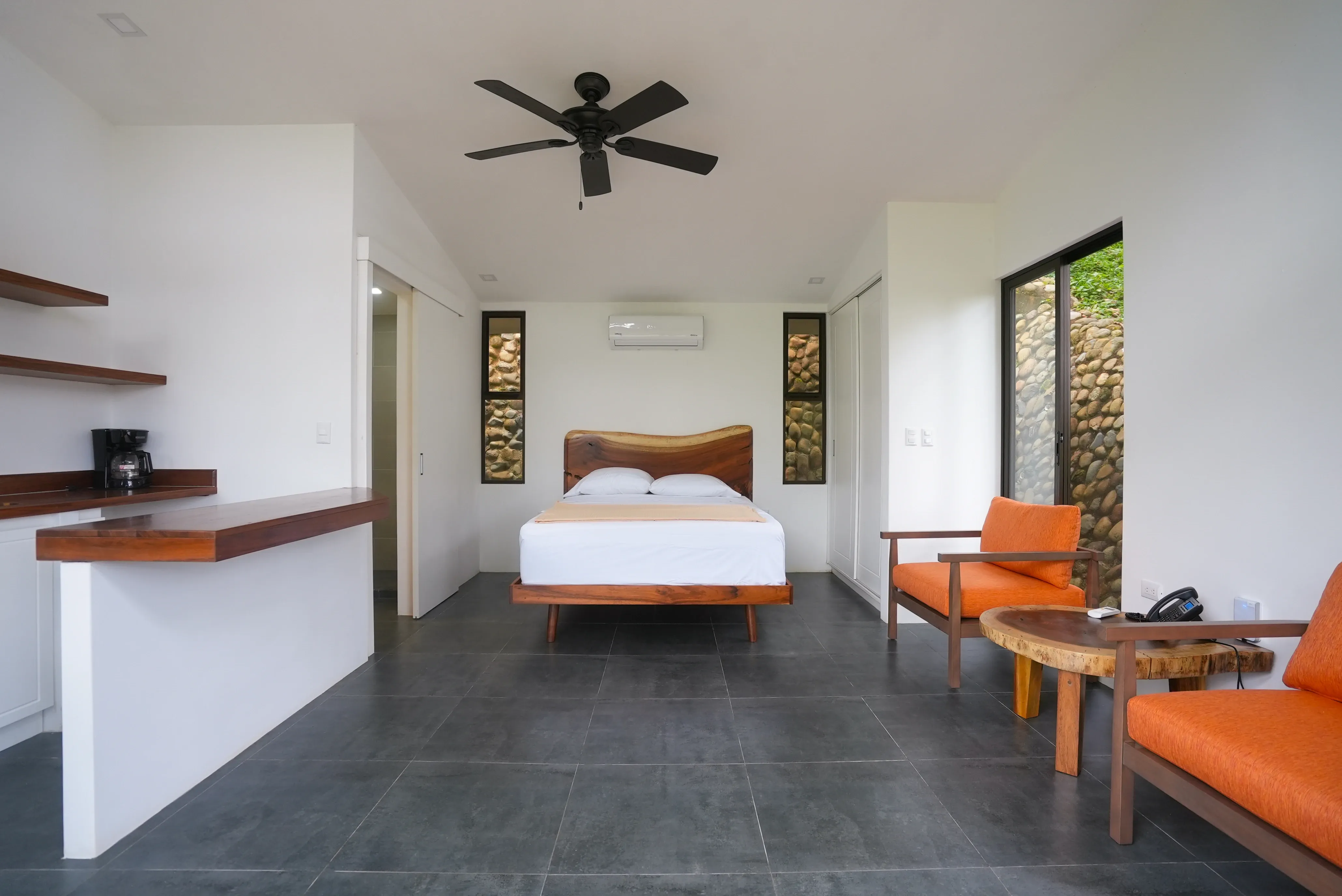Minimalist villa with large windows and nature views at Vajra Jahra Retreat Center, perfect for a peaceful Yoga Retreat in Costa Rica.