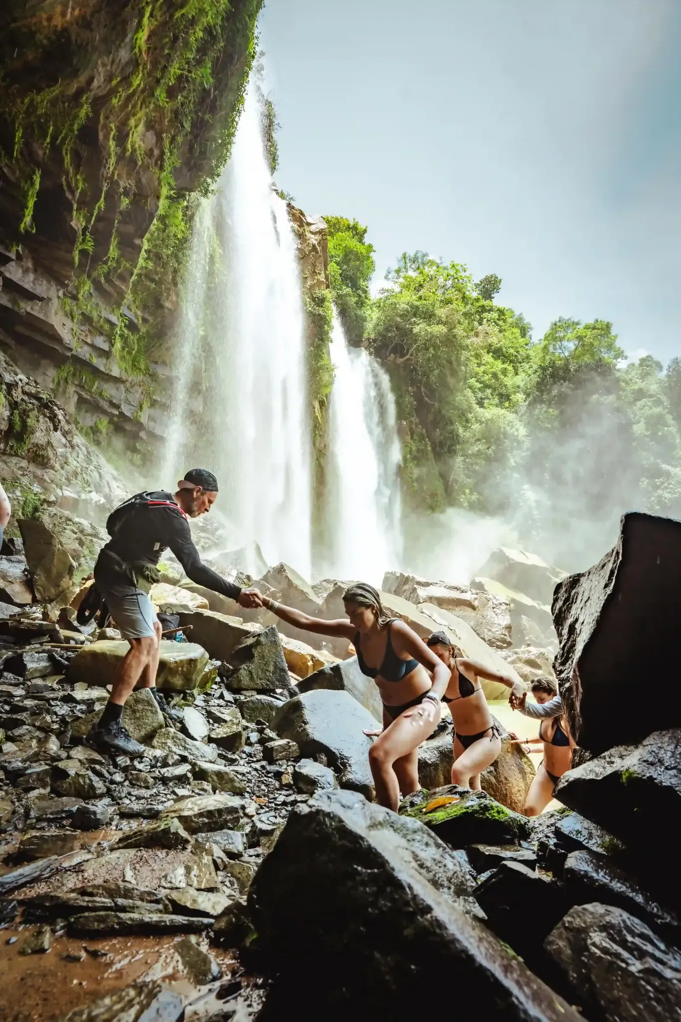 Guests exploring a waterfall near Vajra Jahra Retreat Center in Costa Rica.