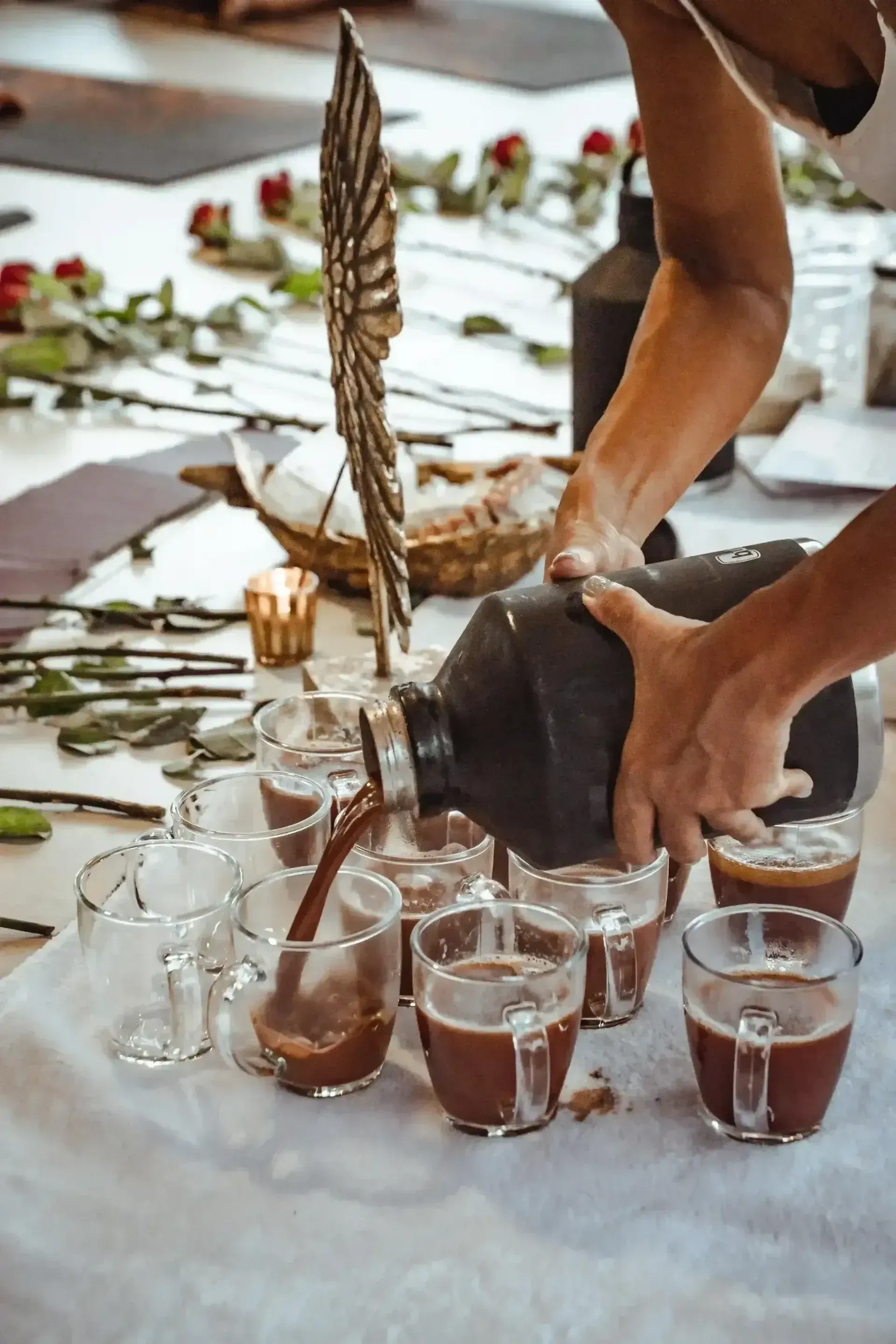 Preparing cacao drinks for a sacred ceremony at Vajra Jahra Retreat Center, a meaningful activity for guests enjoying Family Reunion Vacation Rentals.