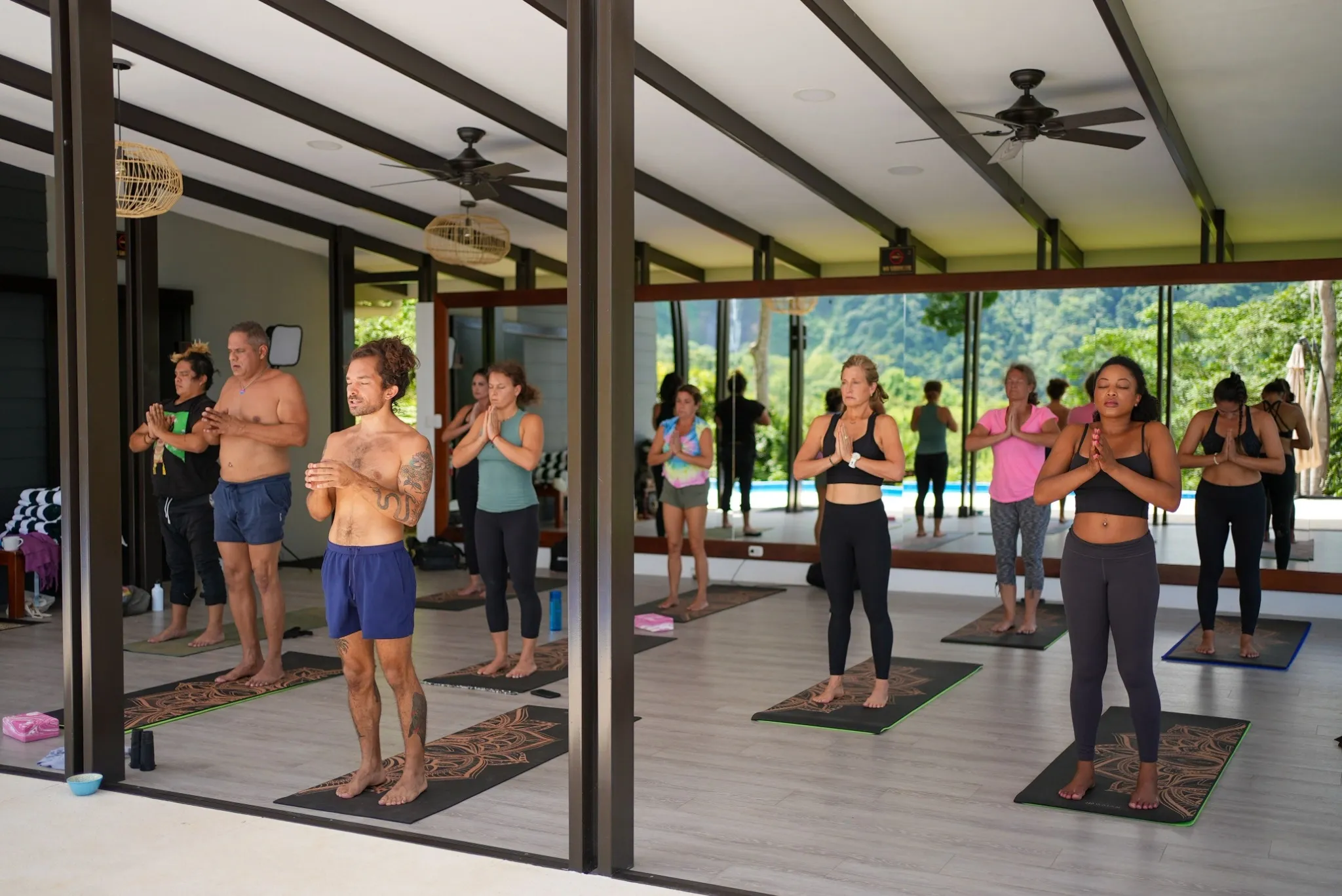 Guests practicing morning yoga at Vajra Jahra Retreat Center, embracing mindfulness and wellness during their retreat Costa Rica experience.