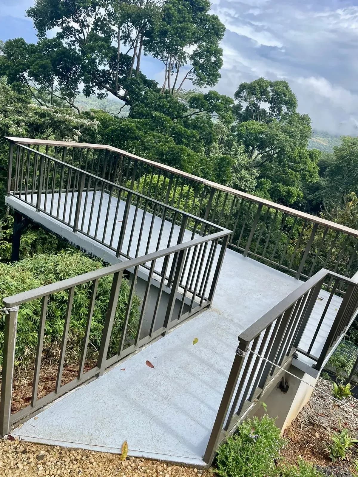 Elevated observation deck overlooking dense tropical greenery at Vajra Jahra Wellness Retreat Center, offering guests a peaceful viewpoint for reflection.