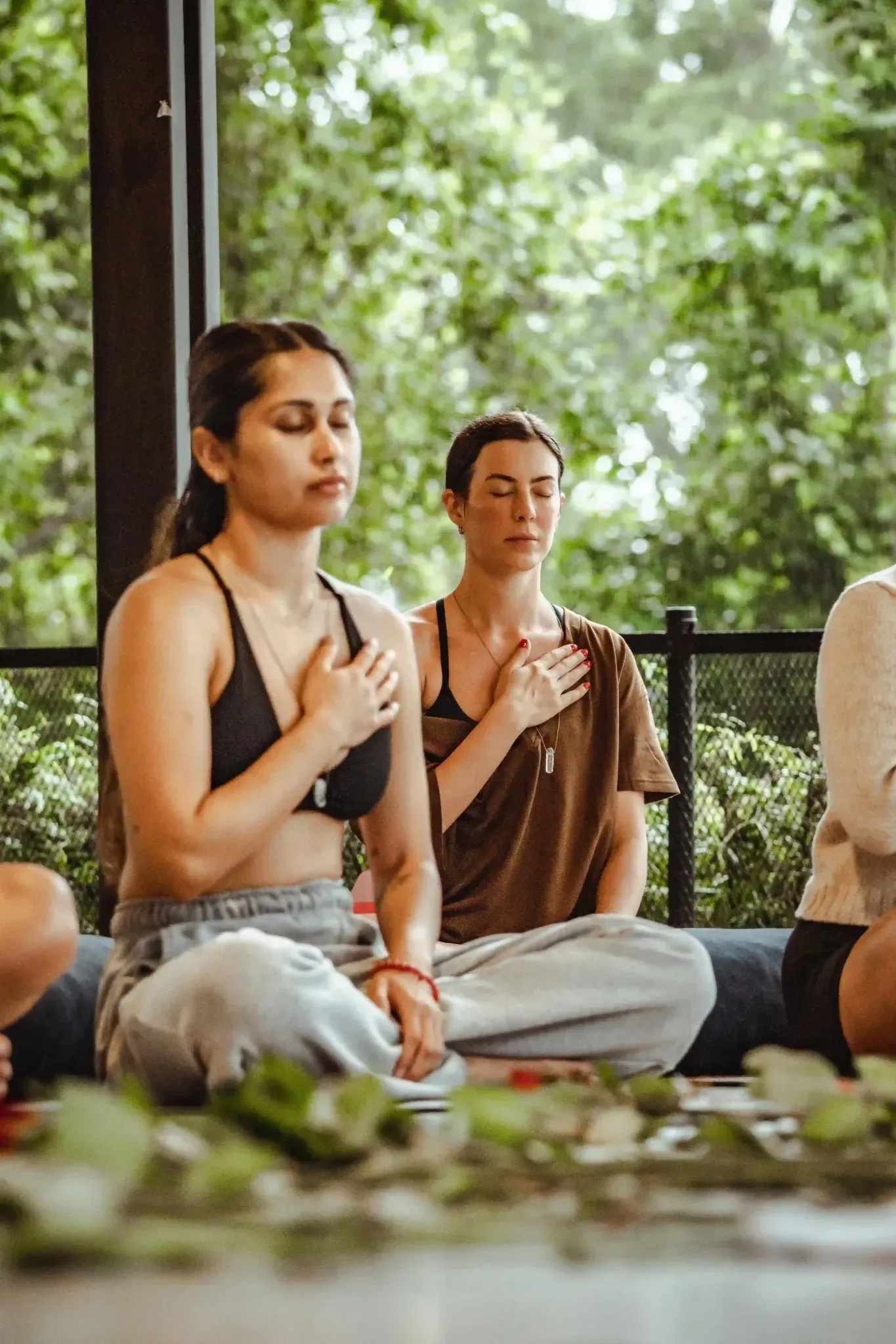 Mindfulness group seated in quiet reflection inside Vajra Jahra Retreat Center, an immersive Costa Rica retreat center in nature.