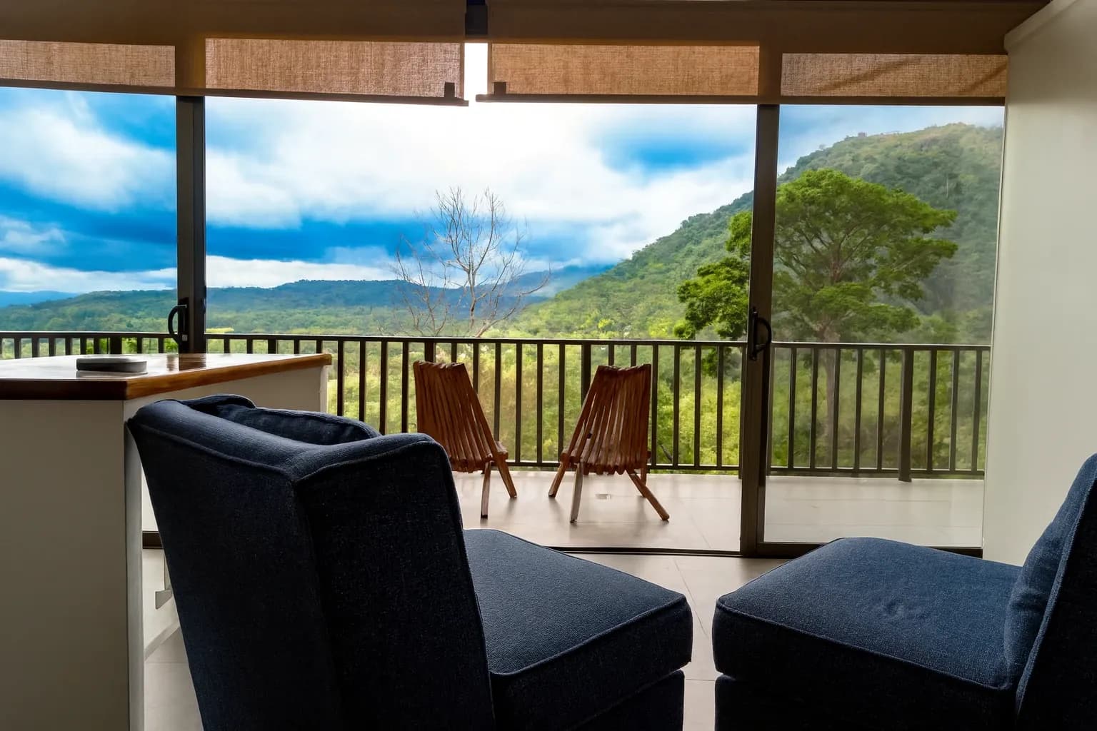 View of the jungle from one of the villas. Showing two chairs on the private deck.